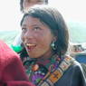 A young Tibetan girl laughing.