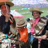 Tibetan women holding umbrellas.