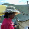 A young Tibetan girl wearing a fancy hat.