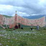 People gathered at the prayer flag frame on top of one of the hills around Larung Gar.