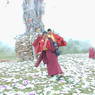 Monks near the cairn after offering juniper incense to local deities.