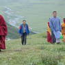 A Chinese monk, layman, and lamas ascending Jomo Hill.