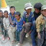 A group of young Tibetan boys visiting a famous temple.