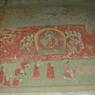 A scene depicting monks prostrating before Shakyamuni Buddha on the walls of the inner circumambulation corridor.