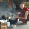 Monk serving noodles