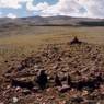 The site, seen from the east. Note the prominent “portal” stones in the foreground.