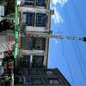 -Vendors and prayer flag pole at north east corner of Bar 'khor