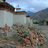 Three stupas and piled mani stones/yak horns behind Ka brgya temple