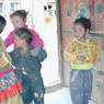Kids playing at door of Ka brgya lha khang of 'Khor chags dgon pa
