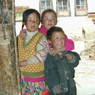 Kids playing at door of Ka brgya lha khang of 'Khor chags dgon pa