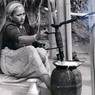 Jaisi woman makes butter (ghiu) to sell on market day