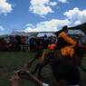 Tibetan men riding horses at the Lhagang Horse Festival.&nbsp;