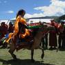 Tibetan man riding horse during Lhagang horse festival.&nbsp;