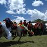 Tibetan man doing a stunt during the Lhagang horse race.&nbsp;