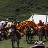 Tibetan men racing horses in Lhagang&nbsp;