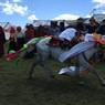 Tibetan man showing off during horse race.&nbsp;