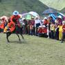 Man racing horse at Lhagang Horse Festival.&nbsp;