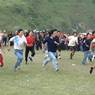 Young Tibetan men racing at Lhagang Festival.&nbsp;