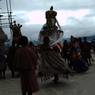 Gonpo Gonmo chham performed lifting their leg nearby Guru statue