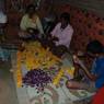 Preparing for flower garland for their brothers