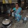Woman cooking during Bhai Tika Ceremony