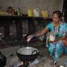 Woman adding sugar while cooking kher