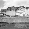 South face of Potala with wall surrounding Zhöl village in the foreground. Copyright Pitt Rivers Museum, University of Oxford 1998.131.302