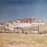 South face of Potala with Zhöl village at base and grassy foreground. Copyright Pitt Rivers Museum, University of Oxford 1998.157.65