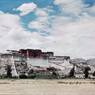 South face of Potala with Zhöl at its base and grassy foreground. Copyright Pitt Rivers Museum, University of Oxford 1998.157.67